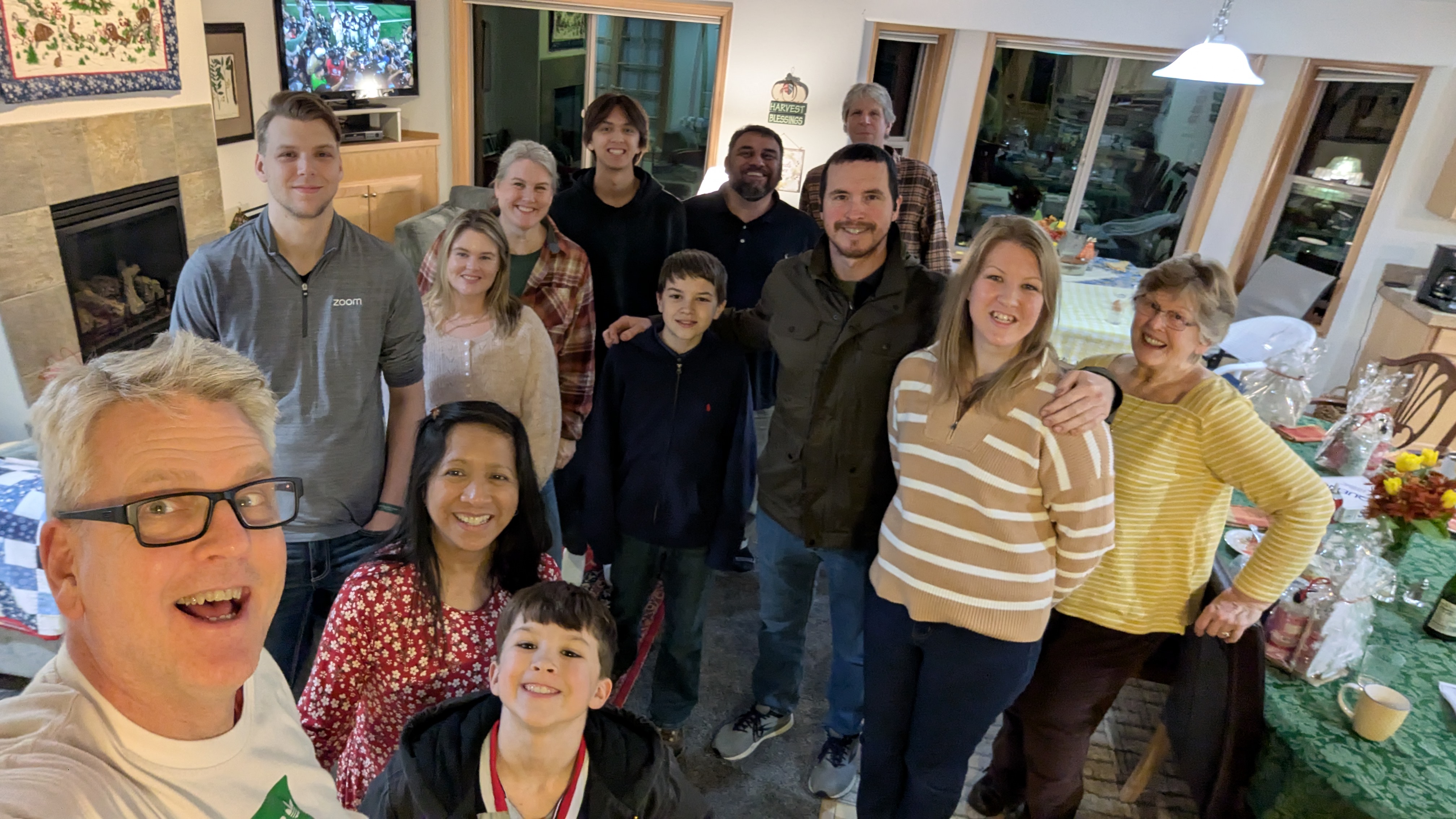 Thanksgiving family picture around the kitchen